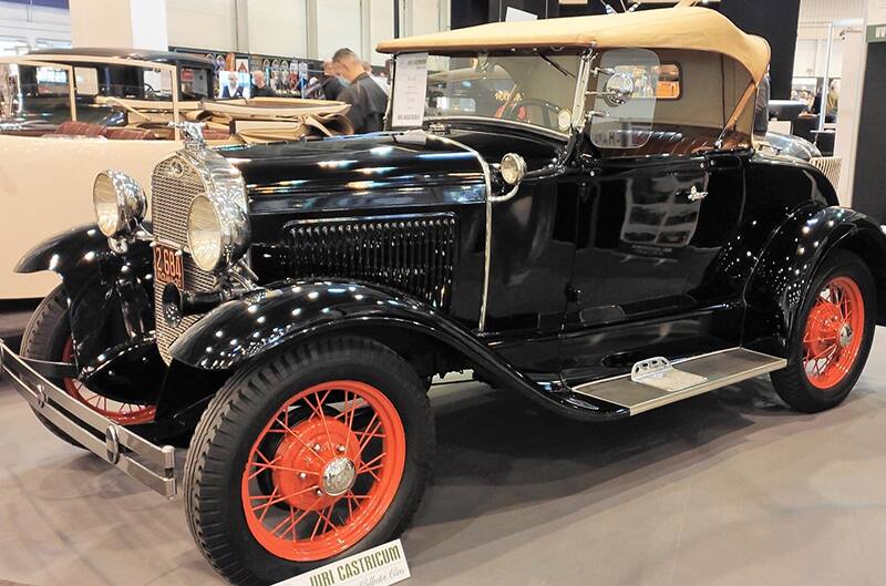 Black Ford model T with orange wheels