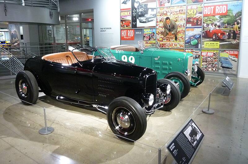 Black 1930s ford with blue one next to it