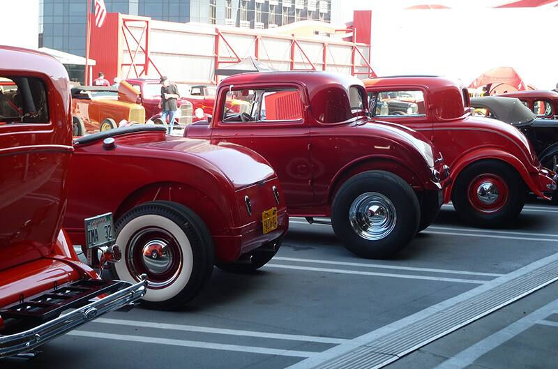 Red 1930s Fords parked in lot