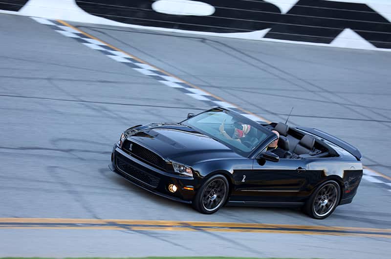 Black S197 convertible on track at speed