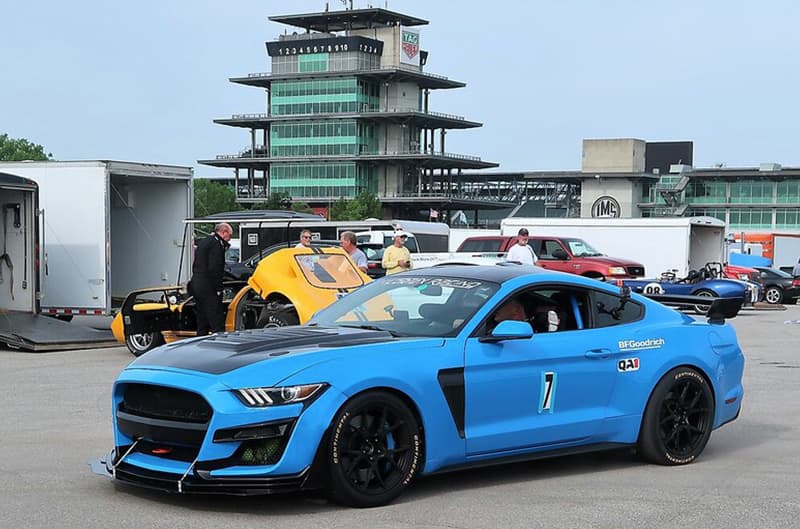 Blue S550 Mustang at track