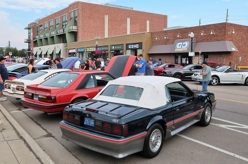 Mustangs parked on street