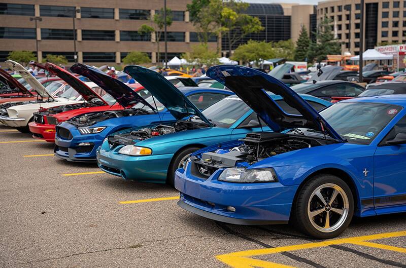 Mustangs parked in AAA parking lot