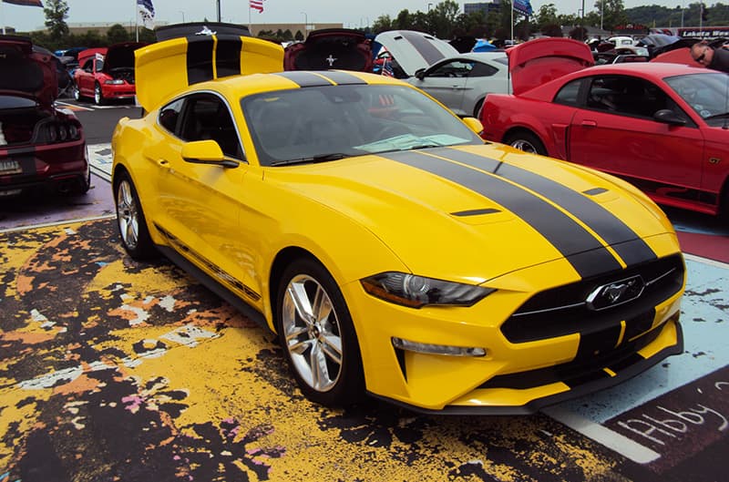 Yellow S550 Mustang with black stripes