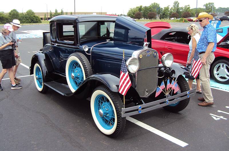 Blue Ford model T with american flags