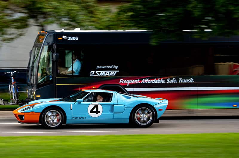 Blue and orange Ford GT in motion