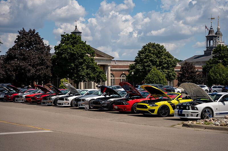 Many mustangs parked as show at auto hall of fame