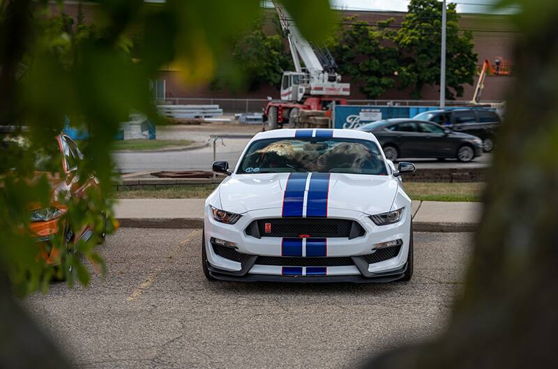 White Shelby GT350 with blue stripes