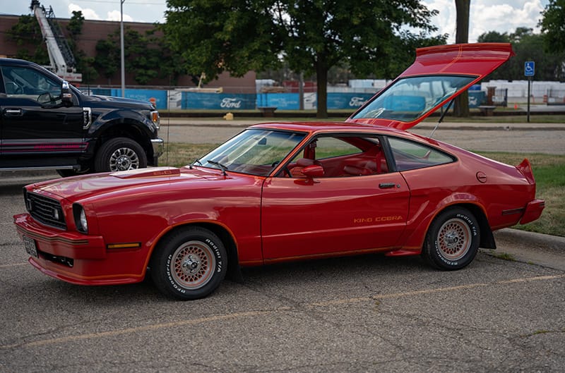 Red Mustang II with rear hatch open