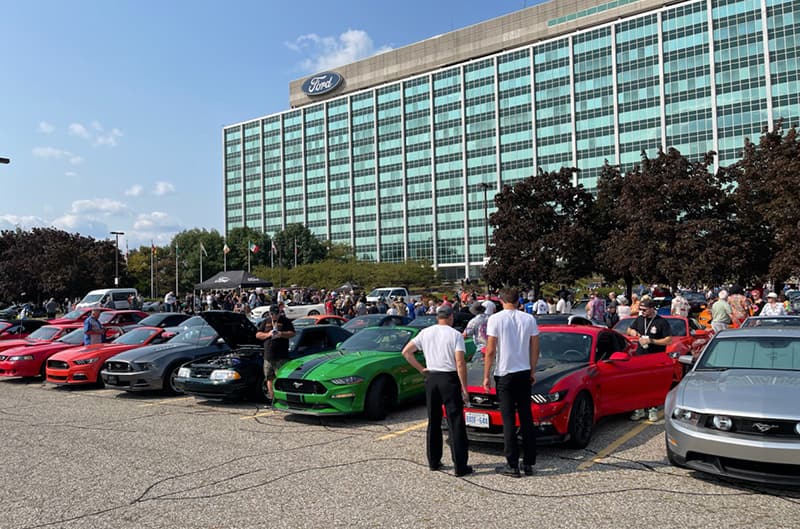 Ford World Headquarters with Mustangs parked at Stampede