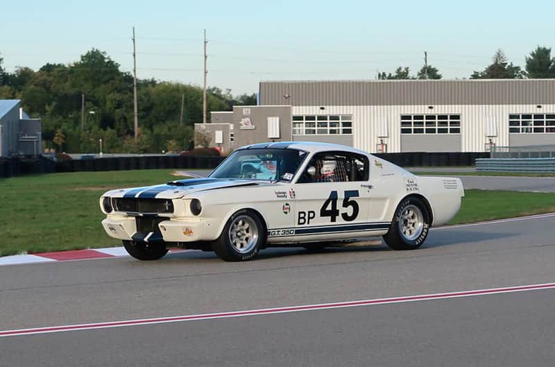 White First gen shelby on track at M1