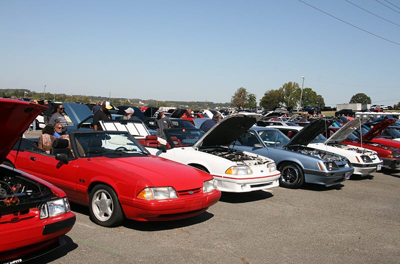 Multiple foxbodies parked at car show
