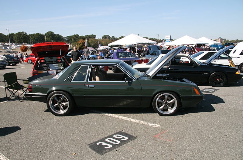 black foxbody from passenger side