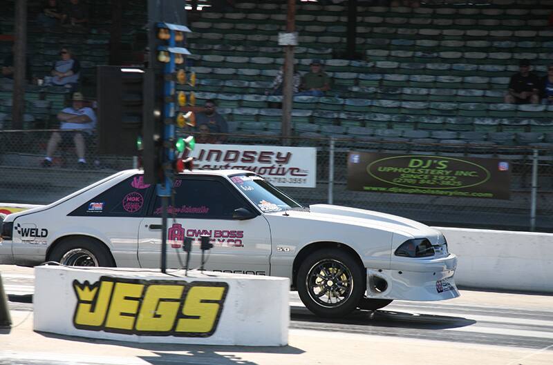 White foxbody mustang on dragstrip