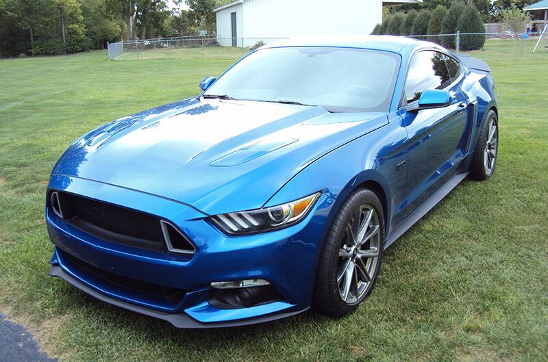 Blue S550 Mustang on grass