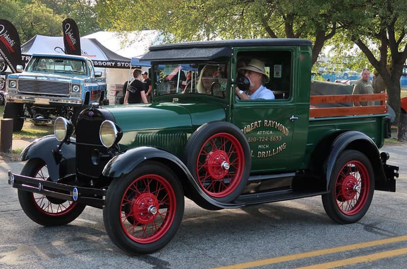 Green Ford Model T pickup with red wheels