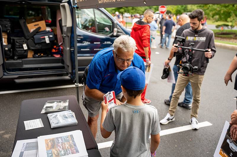 John Clor meeting young enthusiast at show