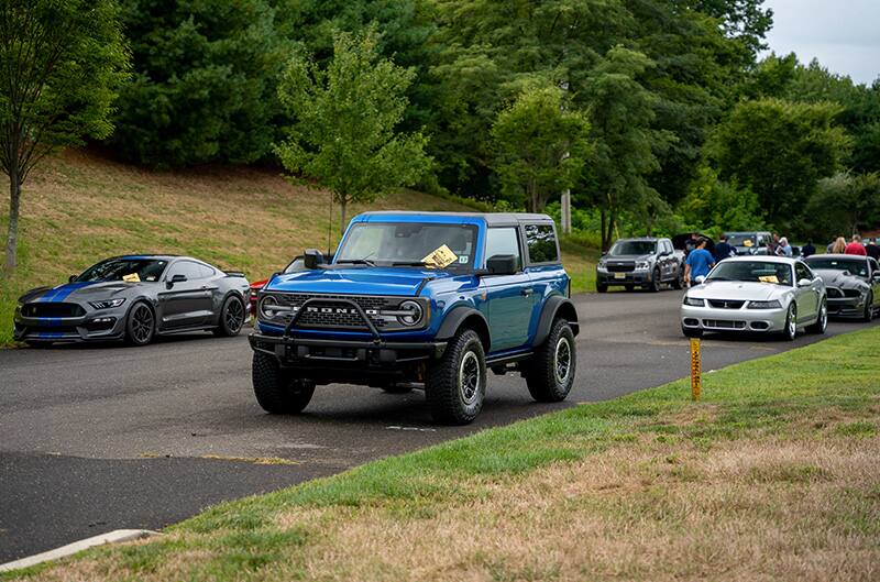 Several fords including bronco at meet