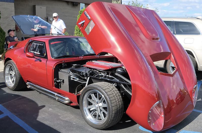 Red Shelby Daytona with hood open in reverse