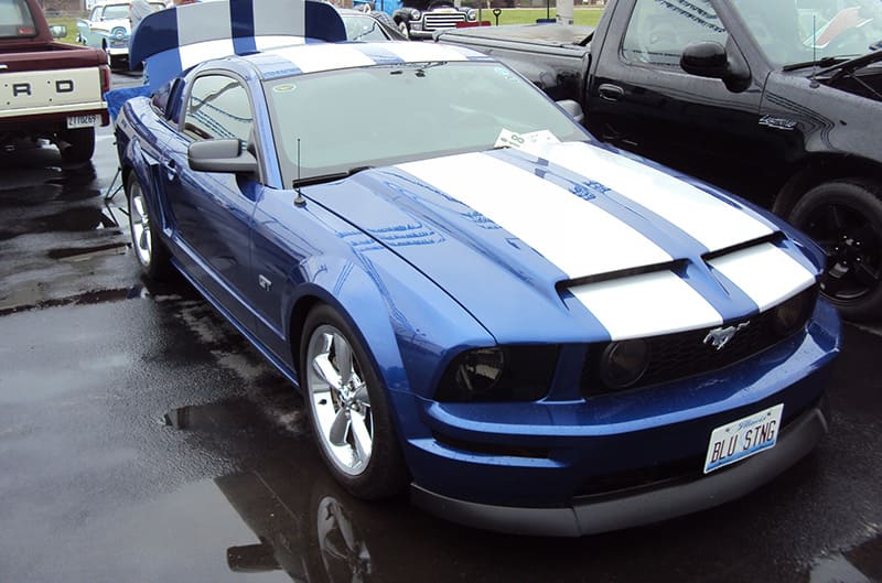 Blue S197 Mustang with white stripes