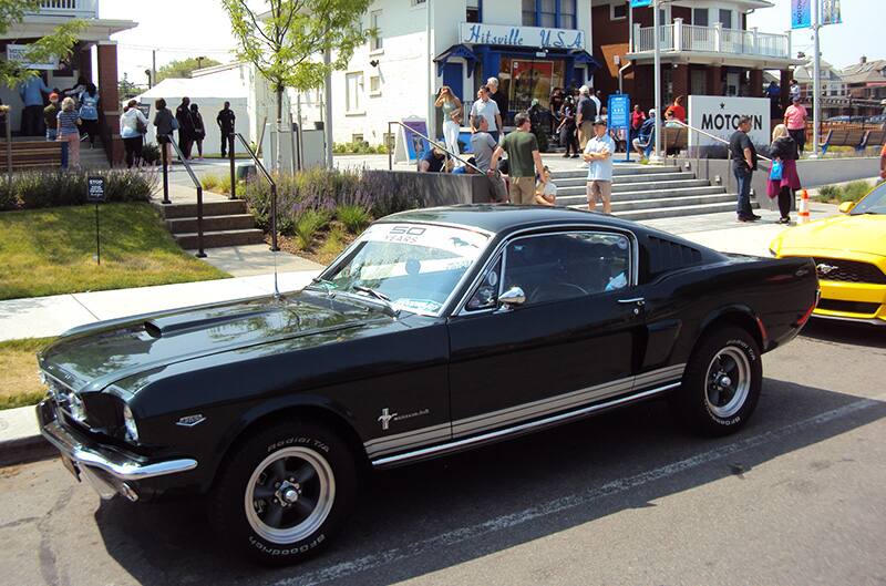 First gen mustang in front of Motown