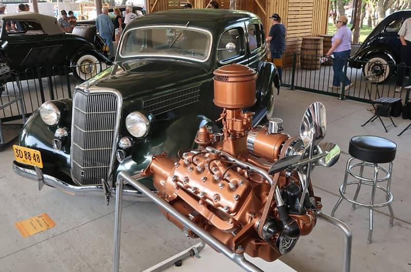 40s ford with flathead engine on stand in front
