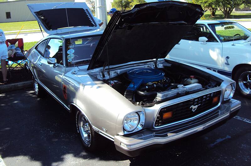 Silver Mustang II with hood up