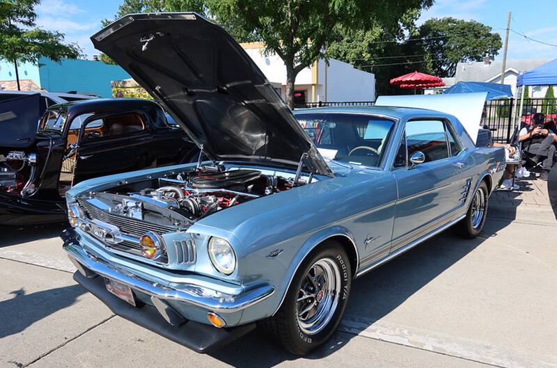 Blue first generation Mustang with hood open