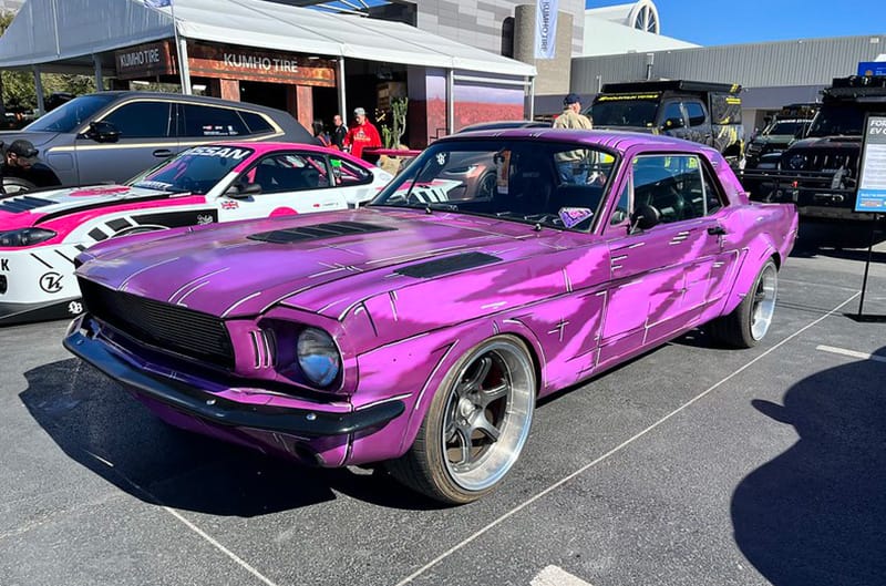 Purple first generation Ford Mustang on display outside