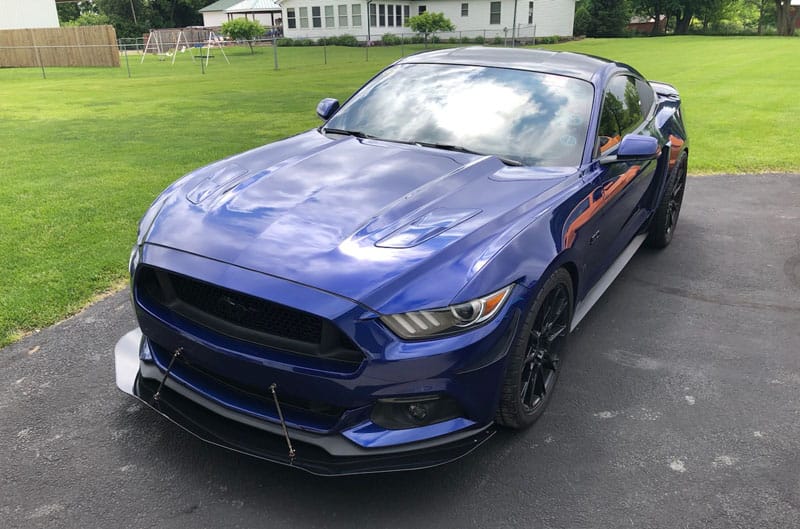 blue mustang in lot