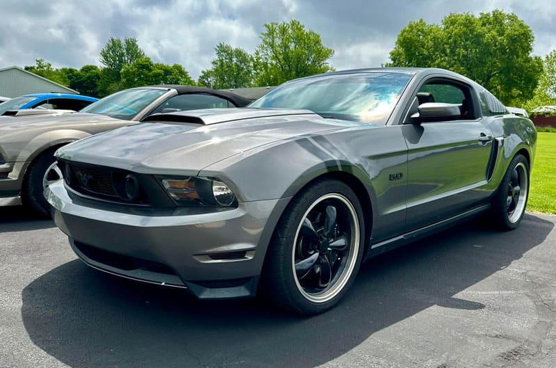 grey mustang in parking lot