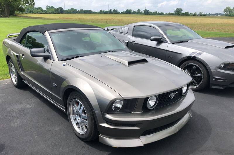 grey mustangs in parking lot