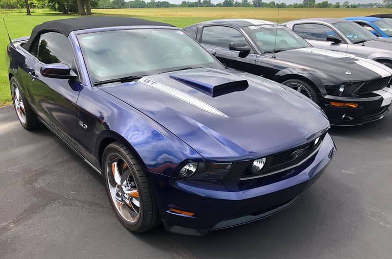 blue mustang in lot