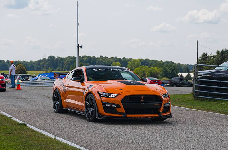 Orange Shelby GT500 Mustang on track entry