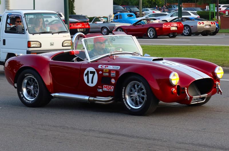 Red Shelby Cobra cruising on Woodward