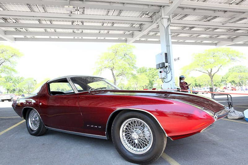 In an outdoor display, the Cougar II sports a Candy Red Apple lacquer paint with a stainless steel roof