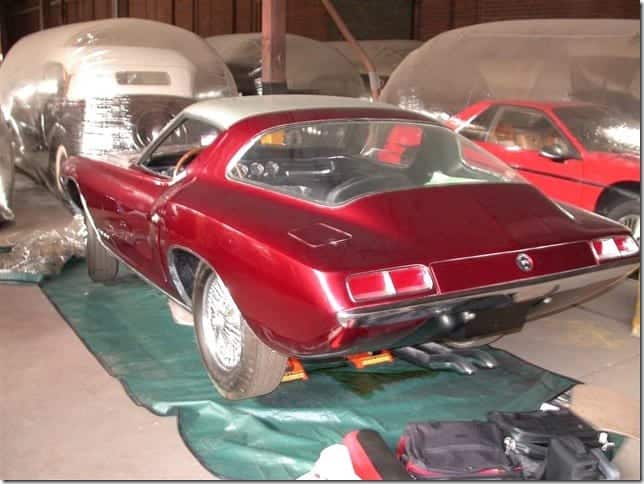 A red Cougar II Coupe pictured in a storage warehouse
