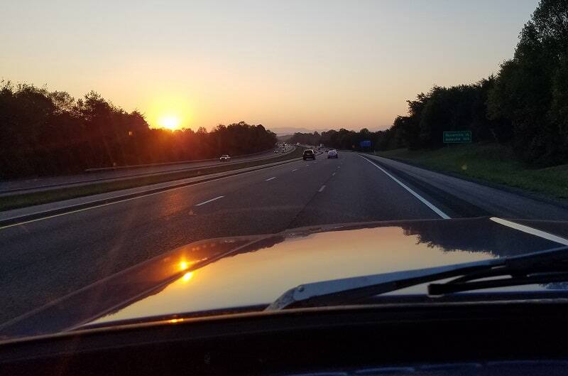View of sunrise and open road