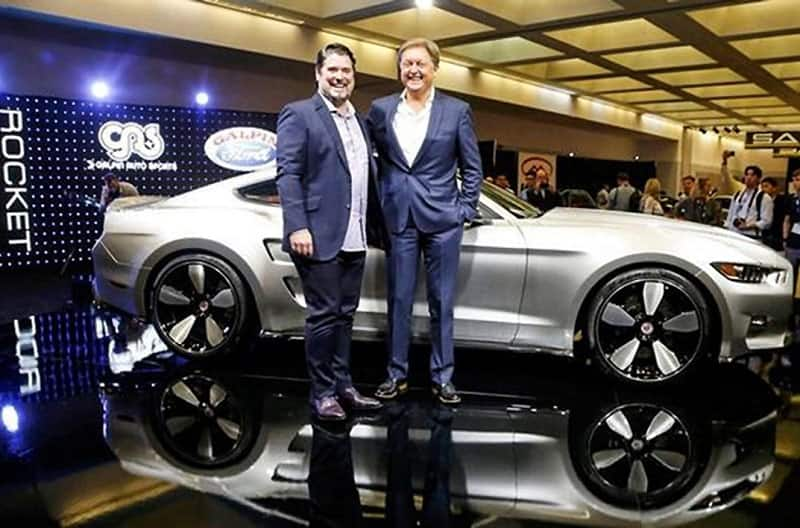 Boeckmann and Fisker in front of silver Mustang Rocket