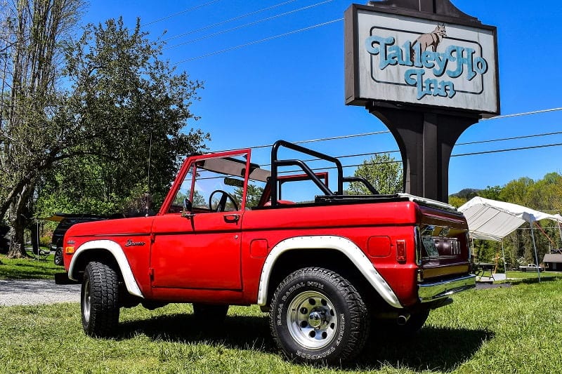 Red Bronco  with drop top in front of Talley Ho Inn