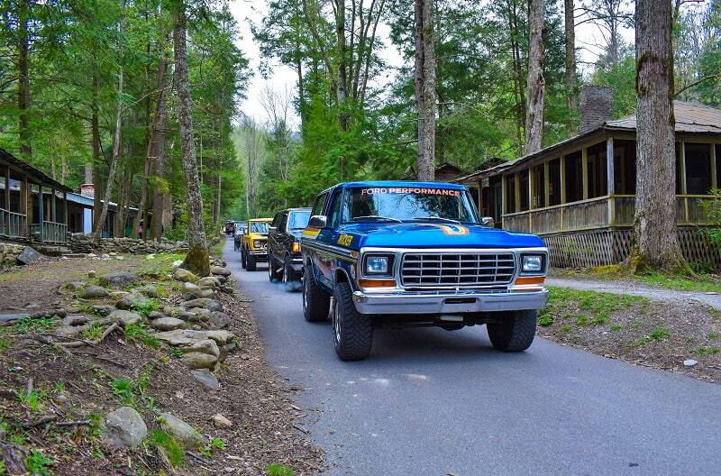 Various Broncos on the road in a line