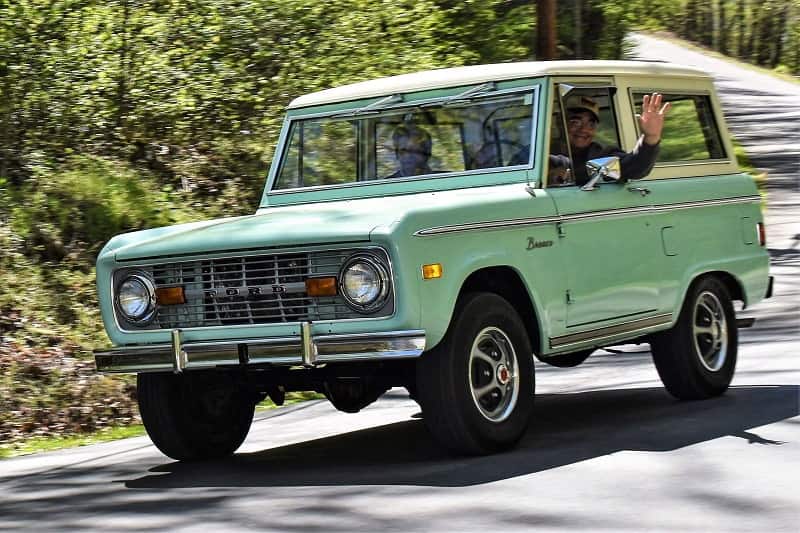 Mint green Bronco on road