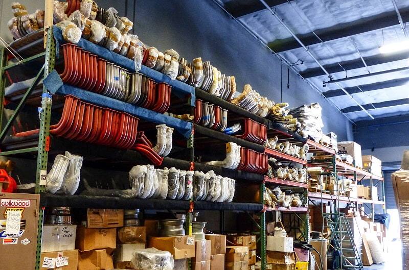 Shelves filled with various car parts in garage