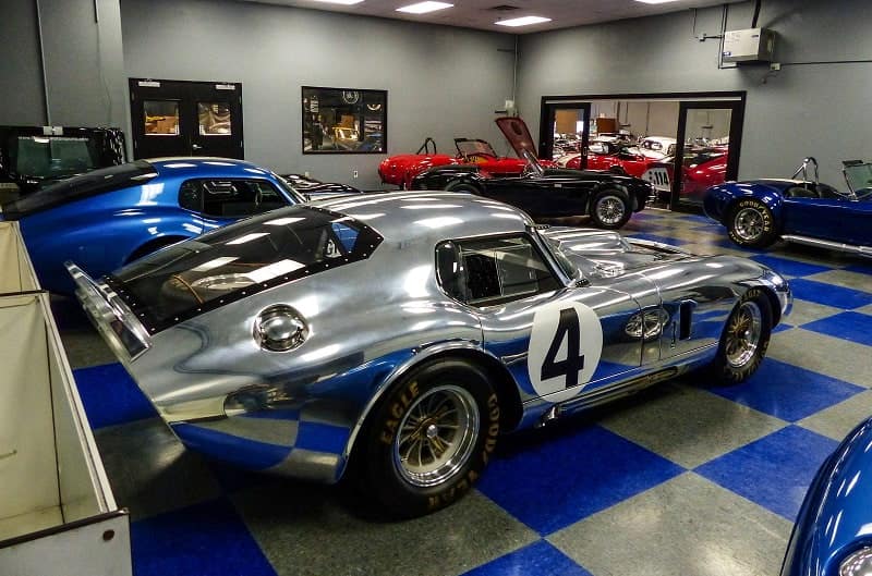 Silver Shelby Cobra in garage