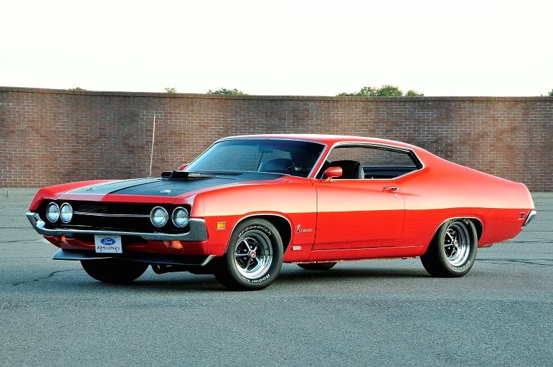 Front profile of red Torino Cobra in parking lot