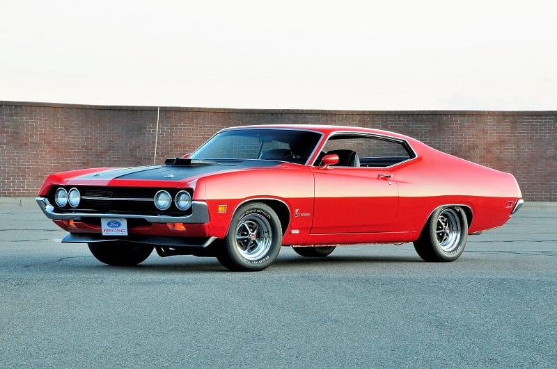 Front profile of red Torino Cobra in parking lot