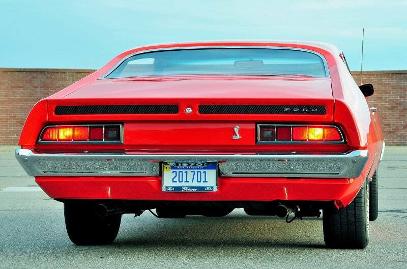 Rear of red Torino Cobra in parking lot