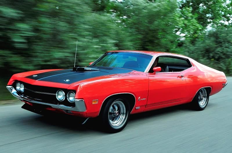 Front profile of red Torino Cobra in parking lot