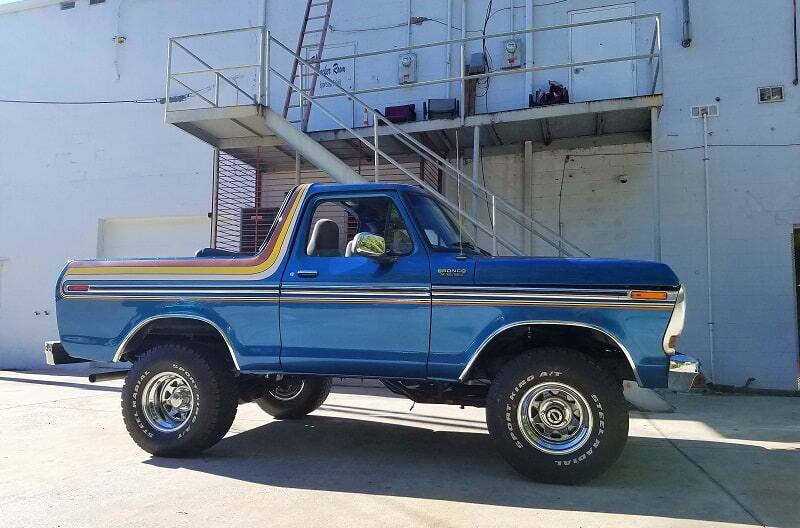 Profile of blue Bronco with trunk hatch off