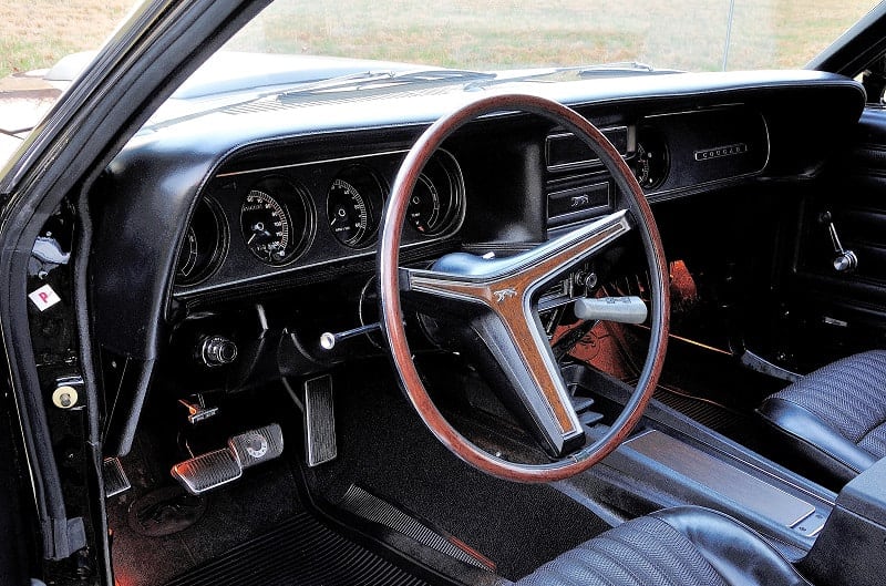 Interior close up of steering wheel and dashboard